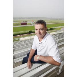 Brett Kitching from the Ipswich Turf Club overlooking a wet track caused by the recent rainfall, Ipswich, 6th January 2011