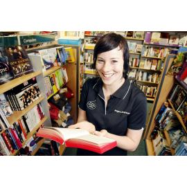 Angus and Robertson shop assistant Kate Denman with a Twilight and Harry Potter book. Both series have been listed as a couple of Ipswich's favourite books, Ipswich, 10th January 2011 
