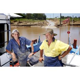 Moggill Ferry captain Greg Mole and former skipper Frank Dobias stayed on board the ferry during the flood crisis to ensure it's safety, Ipswich, 25th January 2011 