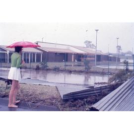 Bundamba Swimming Pool and demolished Racecourse fence at 12:30pm, Ipswich, 26th January 1974