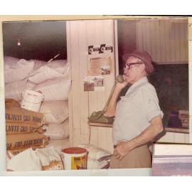 Cliff Risson on the phone in Risson's Produce