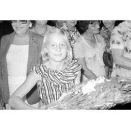 Unidentified girl with bouquet at the the memorial in honour of Mary Aileen Bell, Coochin Coochin, Scenic Rim, April 1980