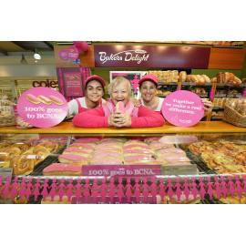 Colleen Julian from Ipswich Breast Cancer Support Group is promoting Baker's Delight pink buns with Kirsten Hutchison and Allison van Der Merwe from Baker's Delight to raise money for Breast Cancer Network Australia, Ipswich, 16 May 2013