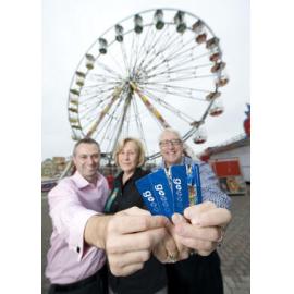 Westside Bus Company general manager Mark Thatcher, Ipswich Show Society president Marcia Cruickshank and Ipswich MP Ian Berry sit in the Ipswich Show ferries wheel with Go Cards, Ipswich, 16 May 2013
