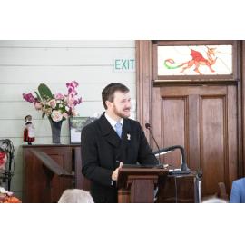 Conductor David Webster sharing the history of the Blackstone-Ipswich Cambrian Choir at the 140th Anniversary service for the United Welsh Church, Blackstone, Sunday 4th October 2026