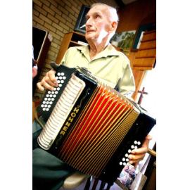 Ron Kerle (aged 84) plays the button accordion for the residents of Lauriston nursing home, Ipswich, 3 February 2005 