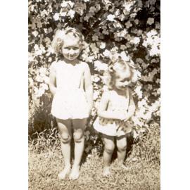 Horn sisters in the garden at Barclay Street, Bergin's Hill, Bundamba, Ipswich, 1940s