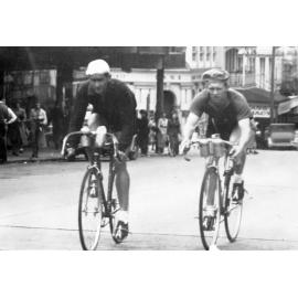 Reg Wettling and Jack Dobbie in Brisbane Street, Ipswich during a 100 mile race from Goodna to Esk return, 1945-1950