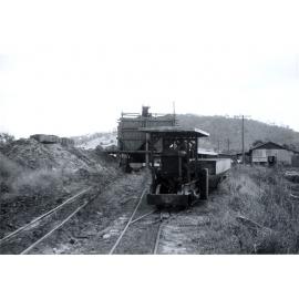 Shuttle train in front of coal loading shute, Caledonian Colliery, Thagoona, Ipswich, 1957