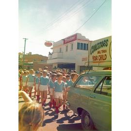 Members of Coalstars Football Club, in unidentified procession at corner of Brisbane and Wharf Streets,  Ipswich, 1960s