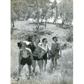 Girl Guides hiking during camping at Allowah Scout Camp, Chuwar, Ipswich, 1956