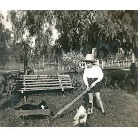 Graham Foote, with pets, in the backyard of Rockdale Farm, Peak Crossing, Ipswich, ca. 1947