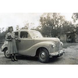 Edna Foote beside an Austin A140, at Rockdale Farm, Peak Crossing, Ipswich, 1950
