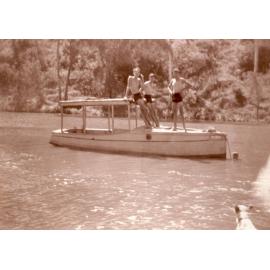 Len and Basil Halls with Stan Clark on Lens boat named the Falcon on the Bremer River, c.1948