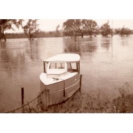 Len Halls boat named the Falcon moored on the Bremer River during a flood,  c.1948