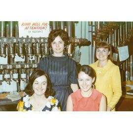 Staff at T. C. Beirne's, with pneumatic cash carrier in background, Ipswich, 1971