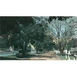 Postcard of service road beside Queen Victoria Parade, looking towards Chermside Road, Ipswich, early 1950s