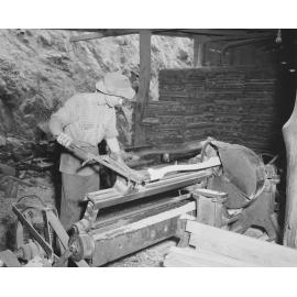 Worker using a lathe at Kruger Sawmill, Byrne Street, Bundamba, Ipswich, 1959