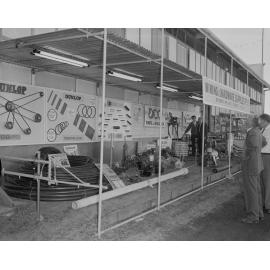 Staff at Mining & Hardware Supplies exterior display, Ipswich Show, Ipswich, 1961