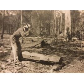 Carl Francis Schmeider chopping timber 